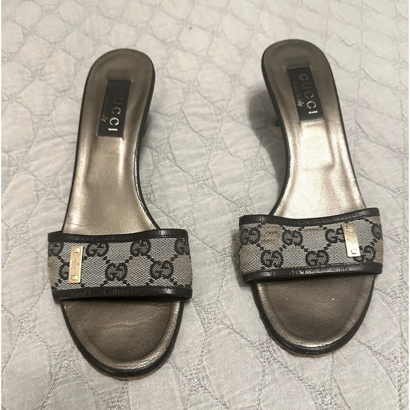 Gucci slip-on sandals. They have a classic open-toe design with a low heel. - Picture 1 of 2